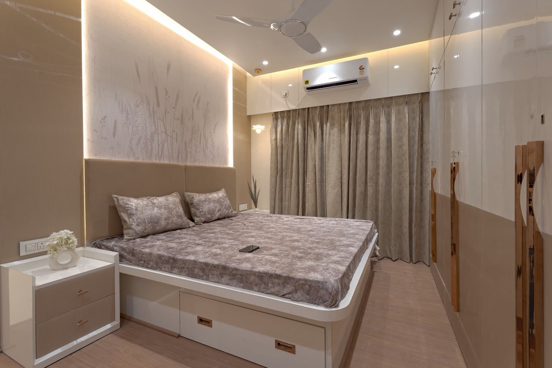 Grey-beige bedroom with platform storage bed, backlit reed-panel headboard and curtained window